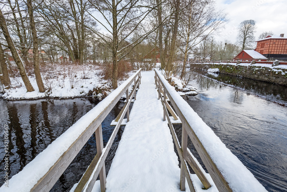Winter scenery with river mill in Sweden Winter scenery with river mill in Sweden