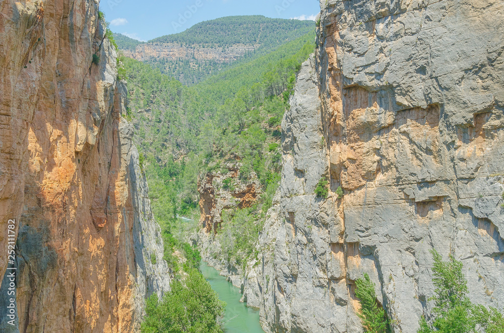 Gorge and mountain scenery. Chillapajaros area, in Montanejos (Castellon - Spain). Natural and beautiful landscape. Climbing zone. Sunny day of summer. Gorge and mountain scenery. Chillapajaros area, in Montanejos (Castellon - Spain). Natural and beautiful landscape. Climbing zone. Sunny day of summer.