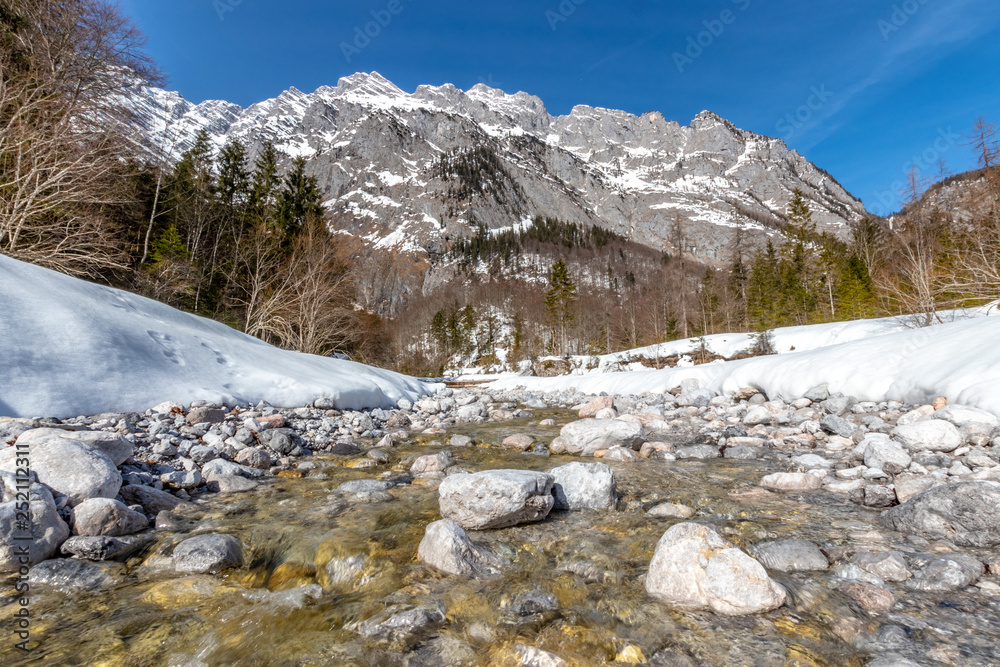 The beautiful mountain 'watzmann' in the bavarian alps (germany) and a nice small creek in the front