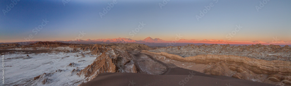 Wide panorama landscape of Moon Valley in Atacama desert, Andes mountain chain in the background, Chile, South America