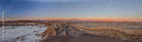 Wide panorama landscape of Moon Valley in Atacama desert, Andes mountain chain in the background, Chile, South America