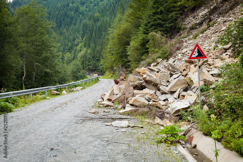 Well predicted falling rocks danger risk road zone photo