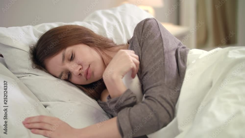 Sick woman checking temperature at termometr. Sick girl measuring temperature Sick woman checking temperature at termometr. Sick girl measuring temperature