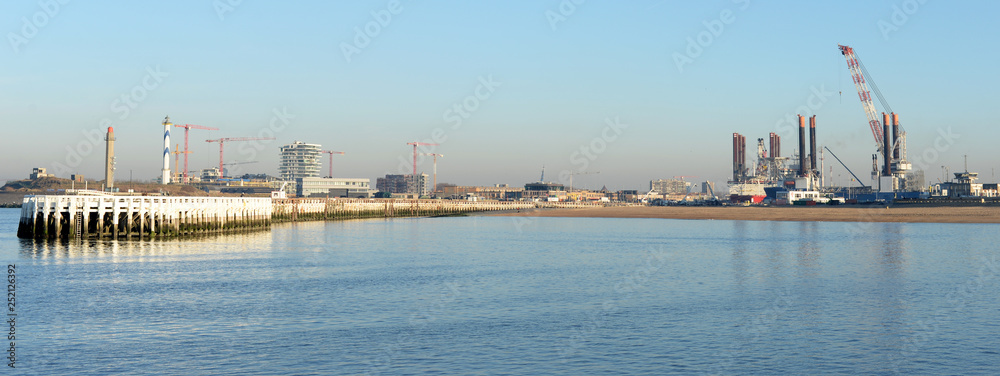 Naklejka premium Panoramic view on port and eastern pier in Ostend, Belgium on a sunny winter evening