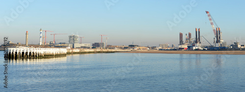 Panoramic view on port and eastern pier in Ostend, Belgium on a sunny winter evening