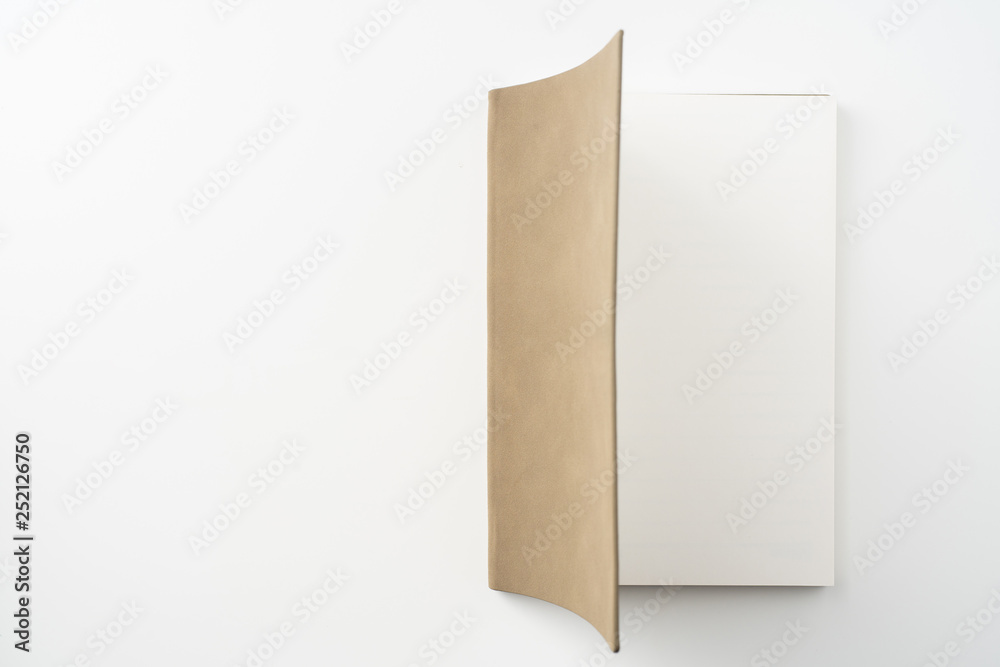 opened brown notebook on white background opened brown notebook on white background