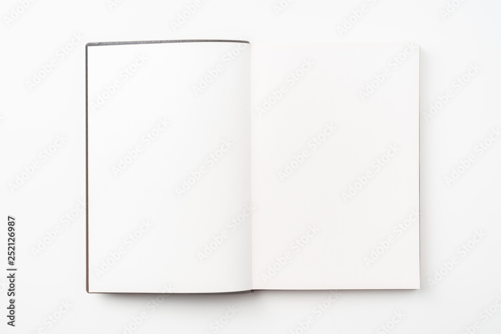 opened red notebook on white background opened red notebook on white background