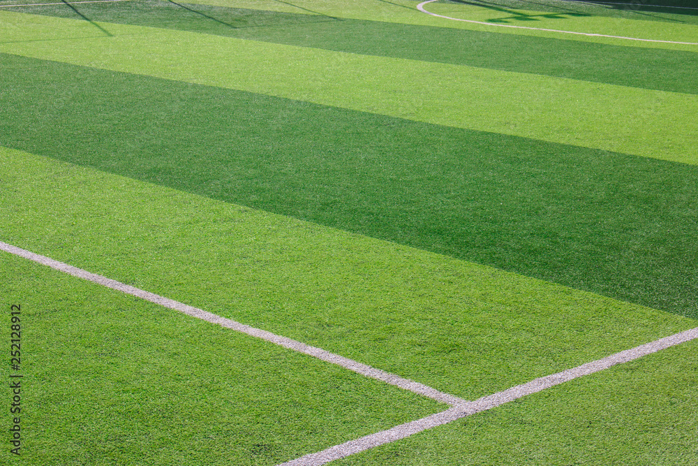 Obraz premium The white Line marking on the artificial green grass soccer field