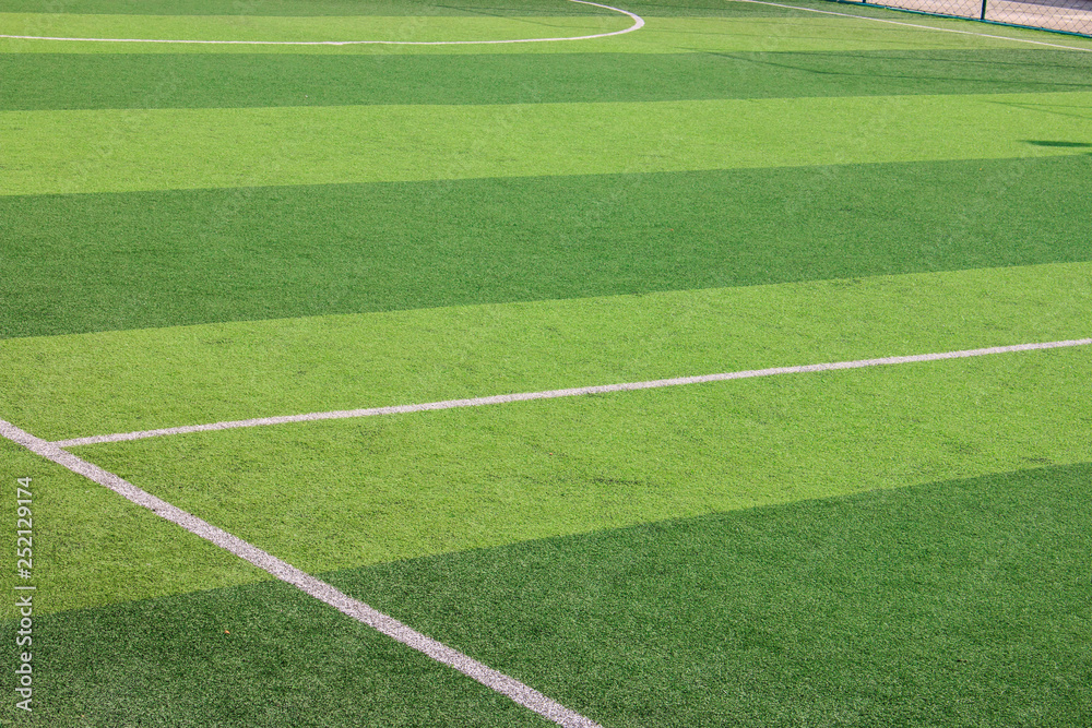 The white Line marking on the artificial green grass soccer field The white Line marking on the artificial green grass soccer field