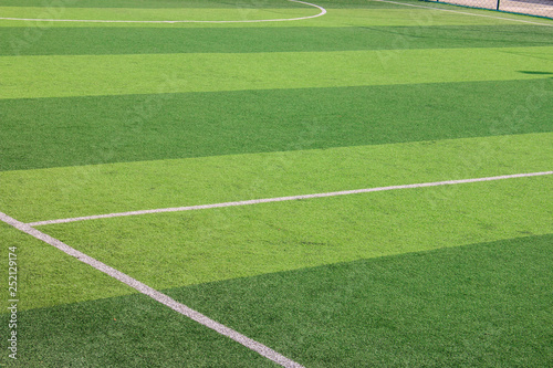 The white Line marking on the artificial green grass soccer field © Fotoglee