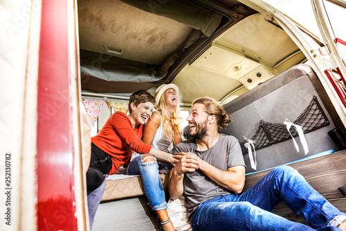 Carefree friends inside a van