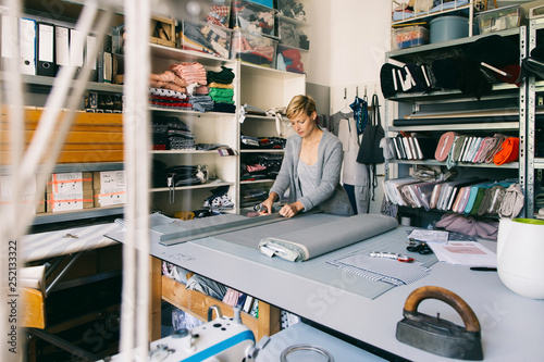 Fashion designer working on template in studio photo