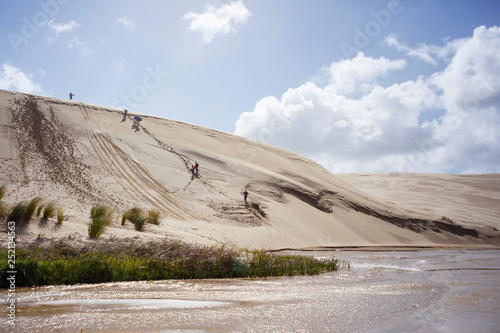 Bodyboarding down the sand dunes in Ninety mile beach