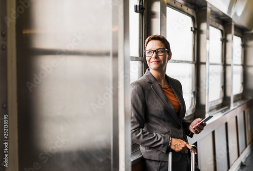 Businesswoman on a ferry looking out of window