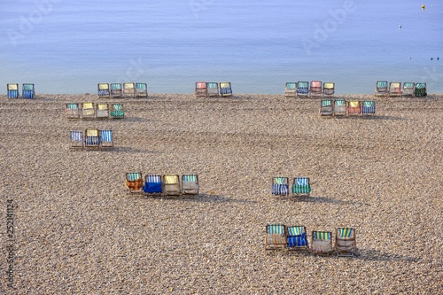 Colorful canvas chairs at the shingle beach, Beer, Jurassic Coast, Devon, England, United Kingdom, Europe photo