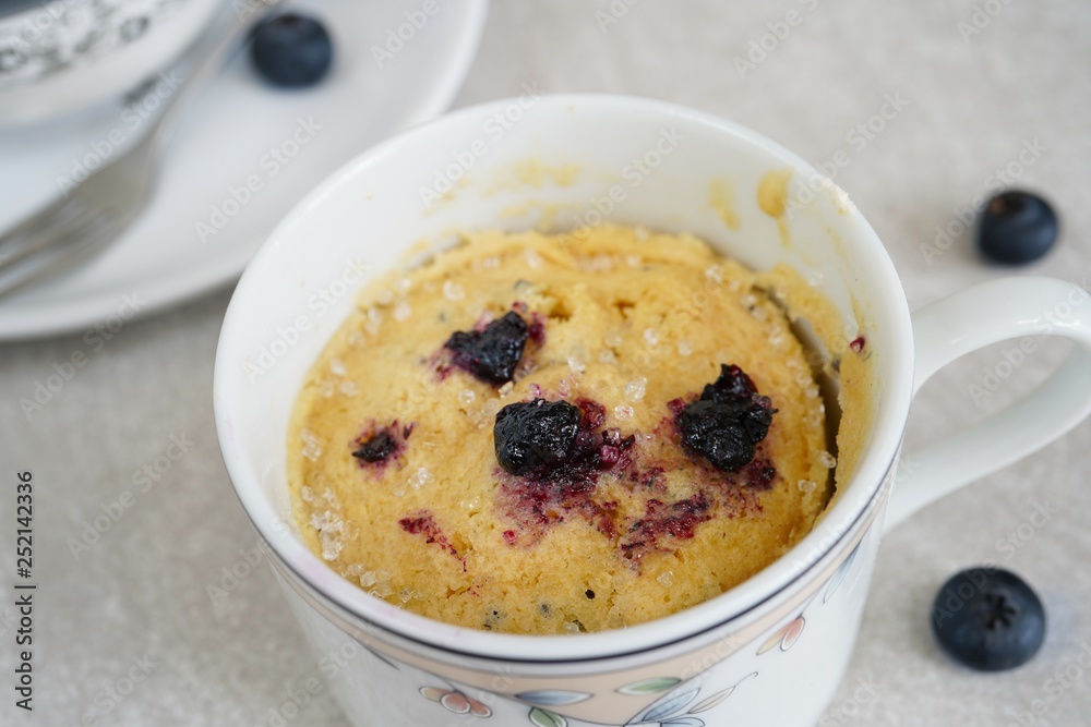 Homemade blueberry mug cake muffin, selective focus