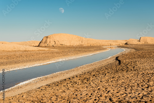 View of salt Rud-e Shur river inside egg  mountains, yardangs in Kaluts desert, part of Dasht-e Lut desert in province Kerman, Iran