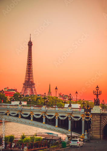 Canvas Print Sunset view of  Eiffel Tower, Alexander III Bridge and river Seine in Paris, France