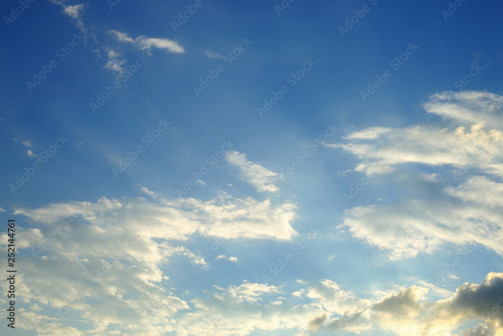 sunlight shine through cloud on dramatic blue sky background