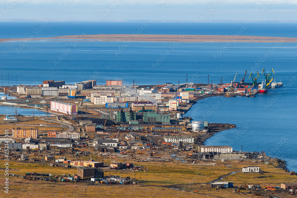 Pevek is the northernmost city in Russia. Summer view of the town, power plant and sea port. Chukotka, Siberia, Russian Far East. Arctic Ocean.
