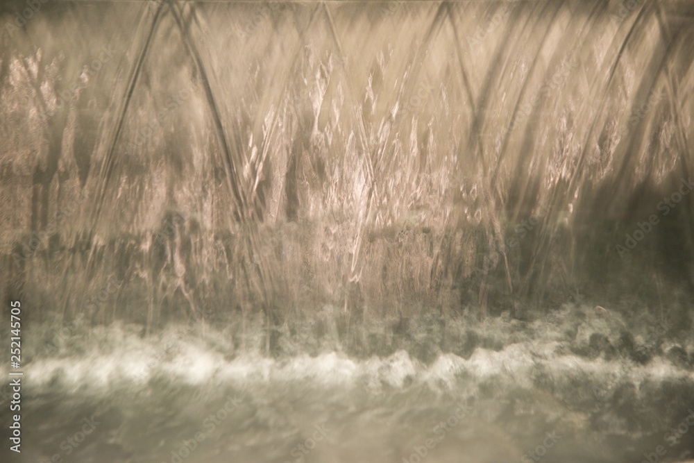Obraz premium Abstract and close up of transparent falling water vertical flows.