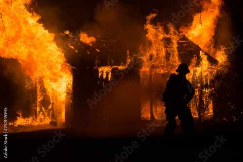 Firefighter Battles Blaze from Shed Fire