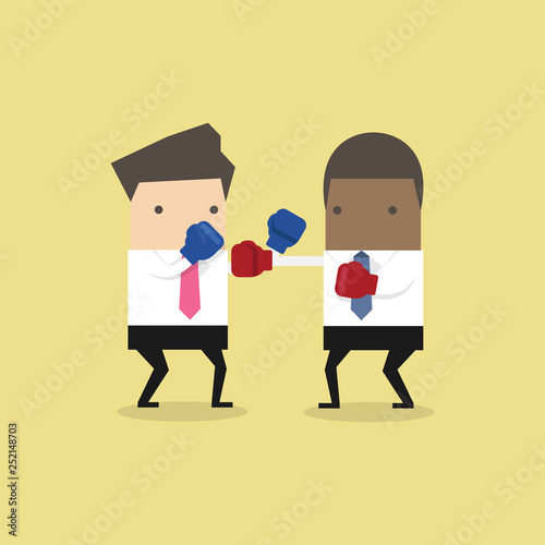 Two businessmen wearing boxing gloves fighting.