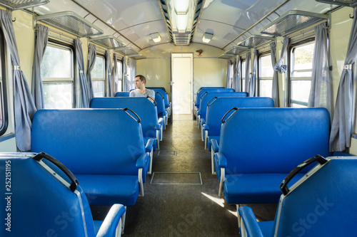 Retro railroad car with one passenger