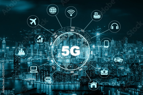 5G technology with earth dot in center of various icon internet of thing over the Aerial View of Hong Kong Cityscape, Wireless communication connection network concept.