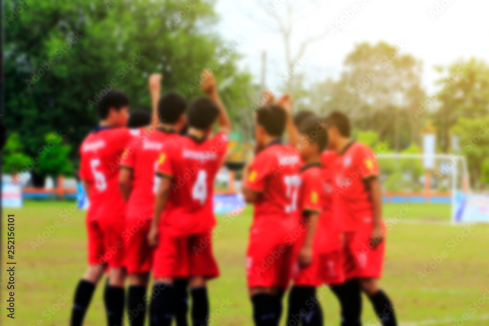 Obraz premium Blurred photo of football player in field 