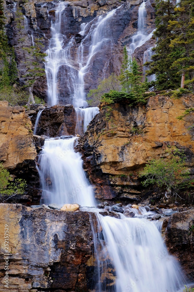Obraz premium Poster perfect composition of beautiful water cascade fall in Canadian rockies can be witnessed on the way to Jasper Alberta, from Calgary