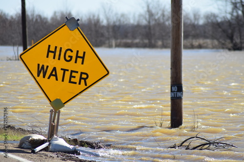 Mississippi flood water sweep across roadways
