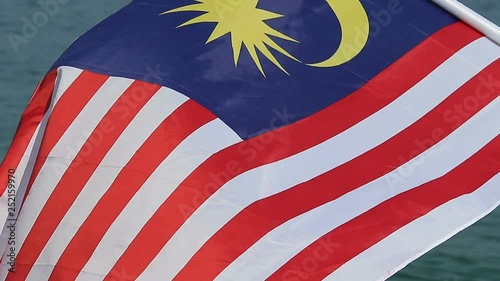 Close-up video waving flag of Malaysia in the air photo