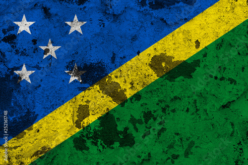 Solomon Islands flag on old wall