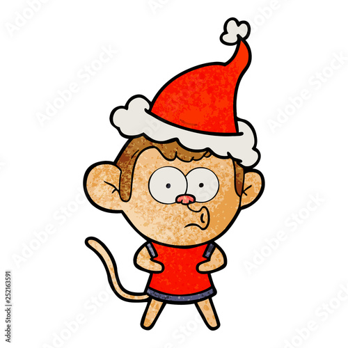 textured cartoon of a surprised monkey wearing santa hat © lineartestpilot