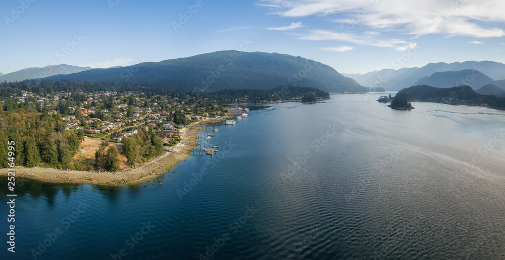 Aerial Panoramic view of a beautiful Ocean Inlet in the Modern City during a sunny summer day. Taken in Deep Cove, North Vancouver, BC, Canada.