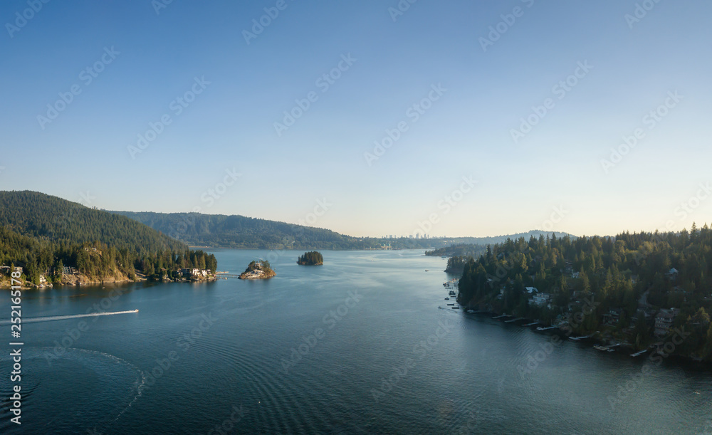 Aerial view of a beautiful Ocean Inlet in the Modern City during a sunny summer day. Taken in Deep Cove, North Vancouver, BC, Canada.
