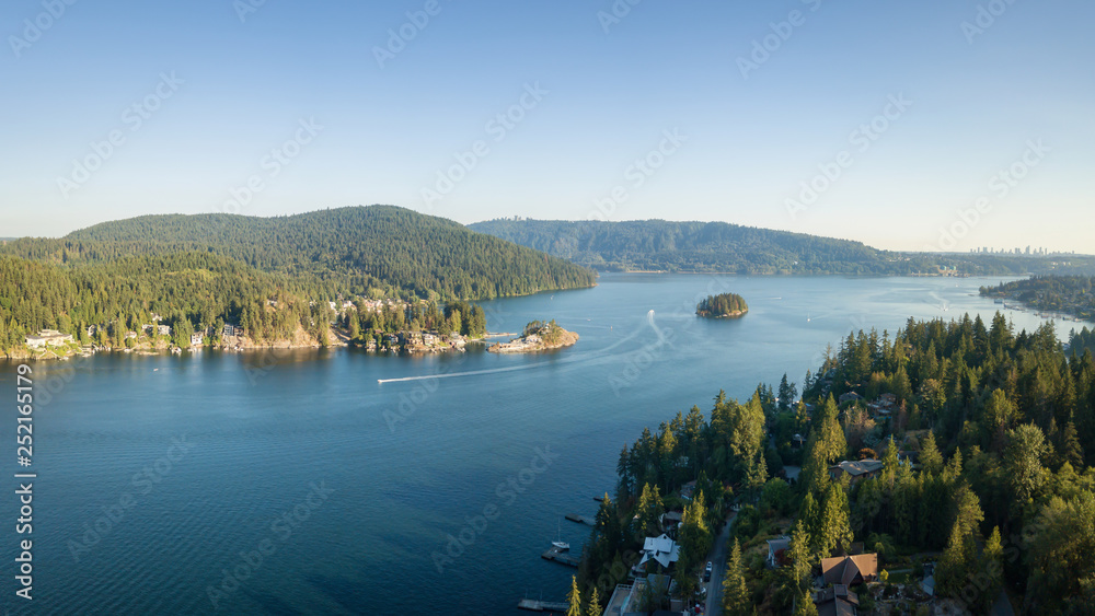 Aerial view of a beautiful Ocean Inlet in the Modern City during a sunny summer day. Taken in Deep Cove, North Vancouver, BC, Canada.