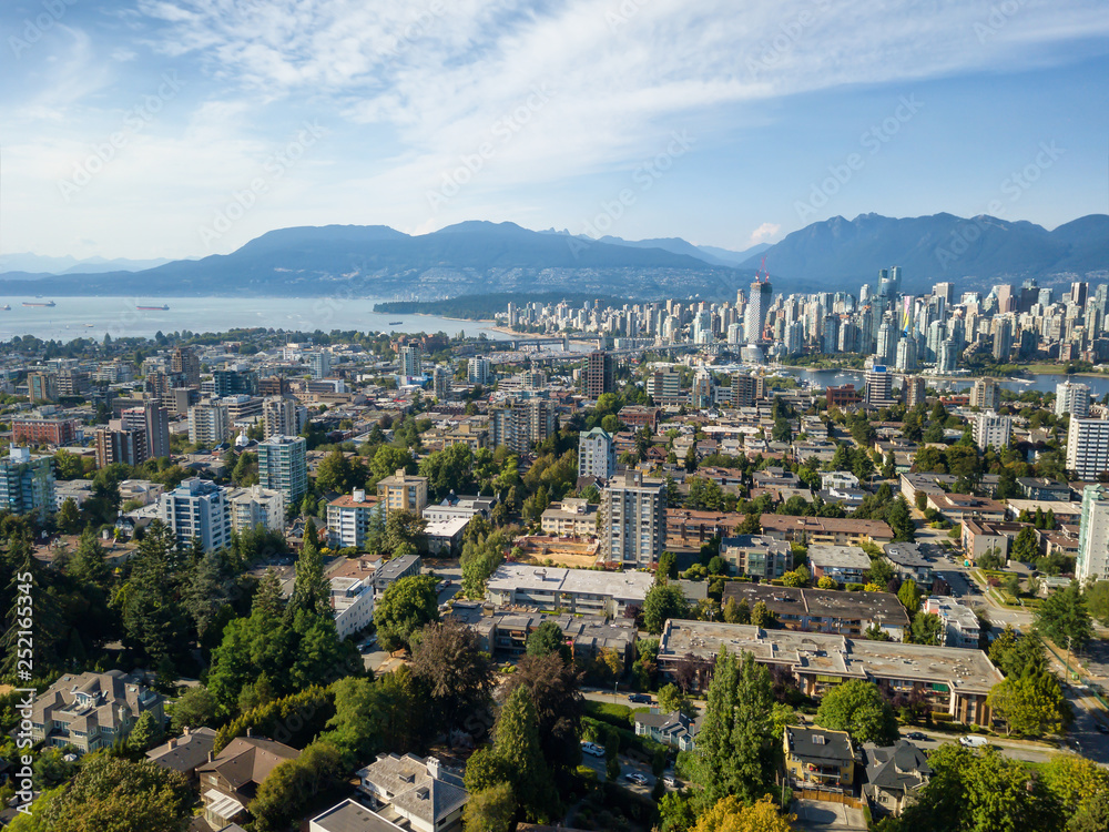 Aerial view of a modern city during a sunny summer day. Taken in Vancouver, BC, Canada.