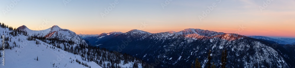 Beautiful panoramic Canadian Landscape View during a vibrant winter sunset. Taken on top of Zoa Peak near Hope, British Columbia, Canada.