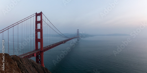 Photography Beautiful panoramic view of Golden Gate Bridge during a hazy sunset