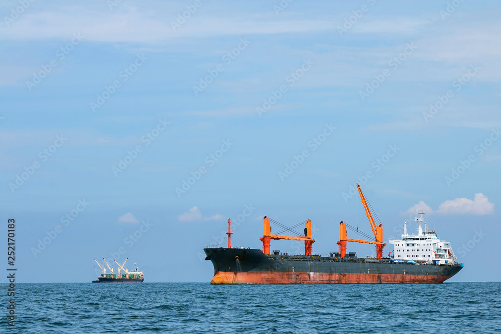 Shipping port, Cargo Ship parking in ocean wait container for logistic Import export in thailand