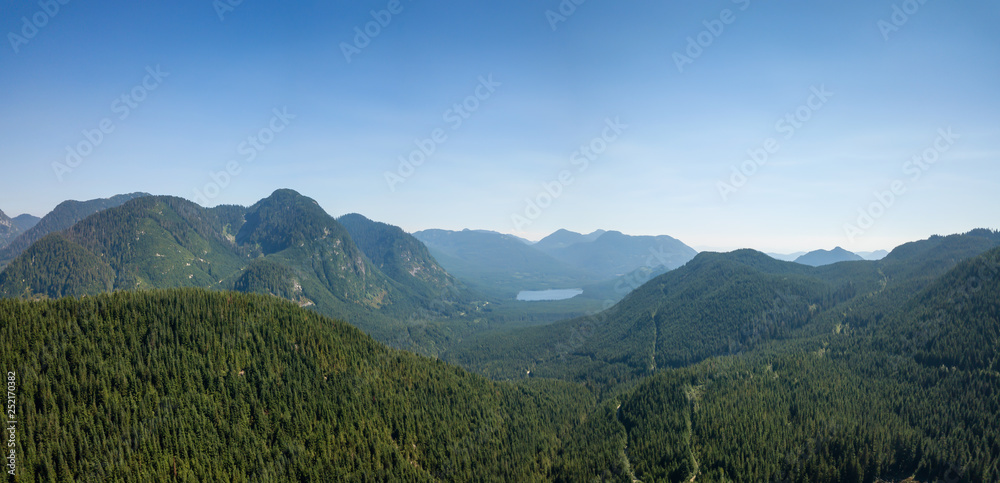 Aerial view of a beautiful Canadian Landscape during a sunny summer day. Taken in Kenyon Lake, located near Mission, East of Vancouver, BC, Canada.