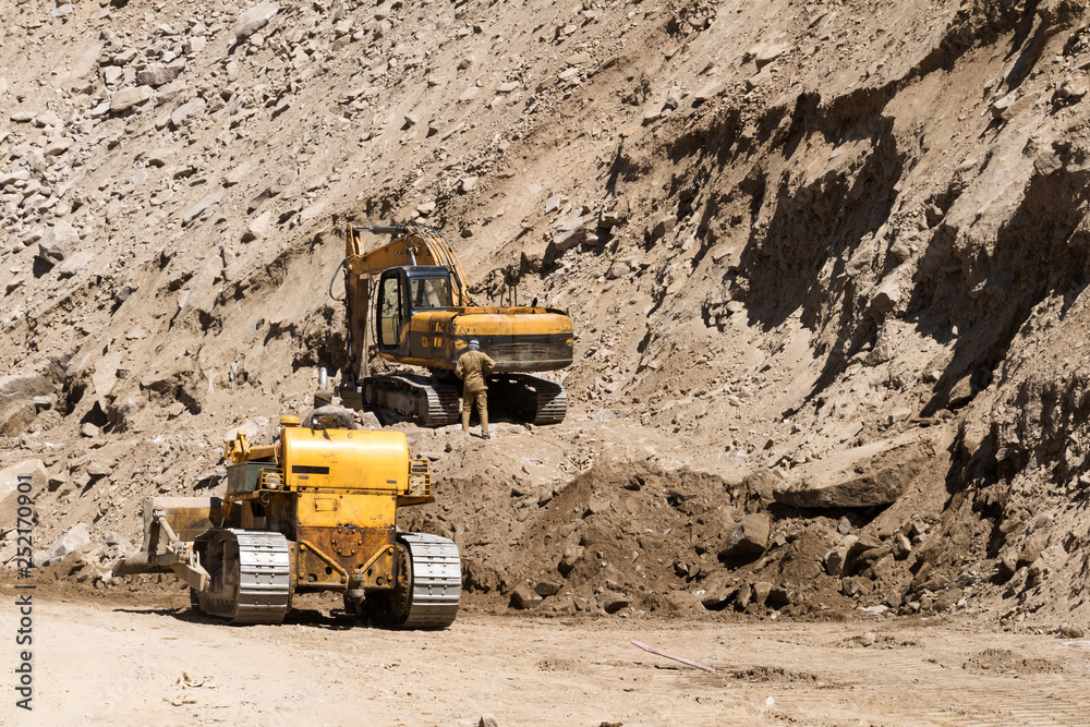 Excavator or large backhoe and Crawler loader be under construction a road Excavator or large backhoe and Crawler loader be under construction a road