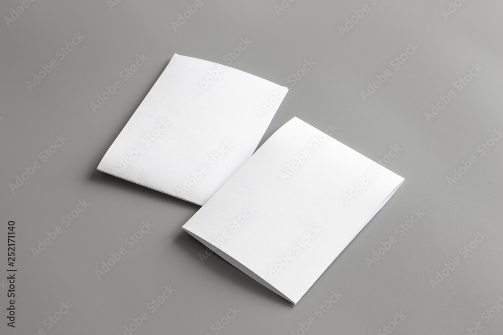 Blank portrait mock-up paper. brochure magazine isolated on gray, changeable background / white paper isolated on gray Blank portrait mock-up paper. brochure magazine isolated on gray, changeable background / white paper isolated on gray