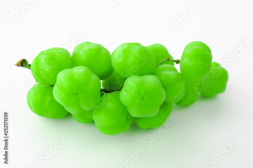 Star gooseberry fruit. Bunch gooseberry. Phyllanthus acidus, Native gooseberry fruit photo