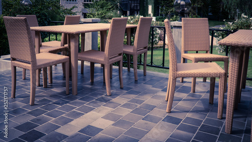 Group of rattan chair and table on backyard terrace