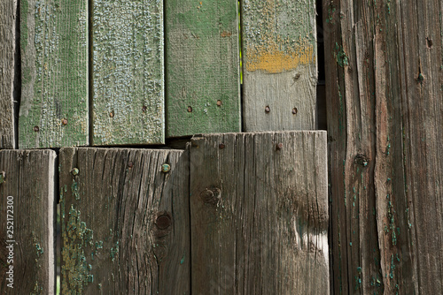 Wooden background with green paint residues. Abstract background