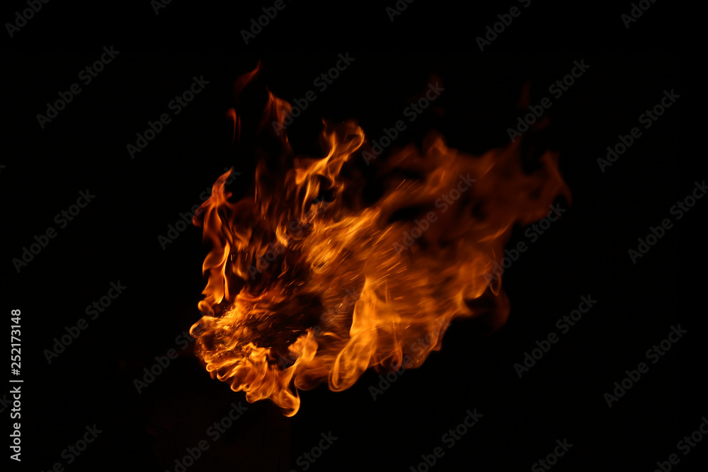 Fototapeta premium Fire flames on black background.