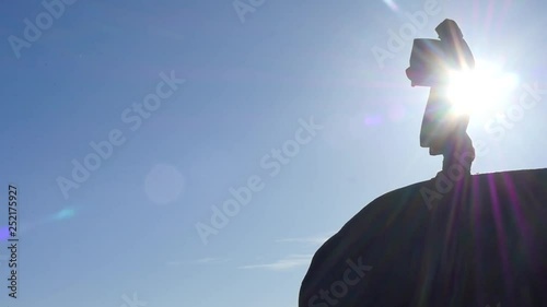 early times man in hoodie with lobby in chest at the cliff edge silhouette